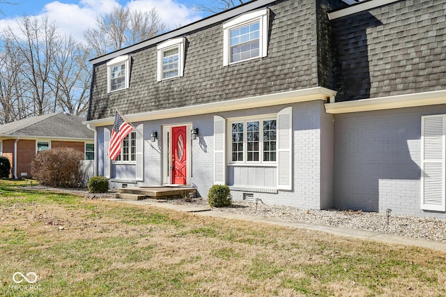 1310 Bowman Dr, Greenfield, IN 46140 - view of front of house with brick siding, mansard roof, and a shingled roof