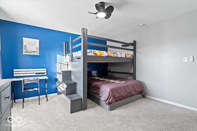 bedroom with baseboards and carpet