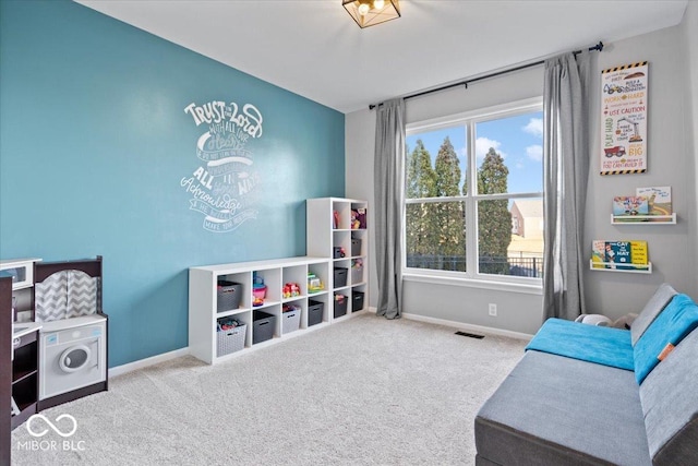 recreation room featuring visible vents, baseboards, and carpet