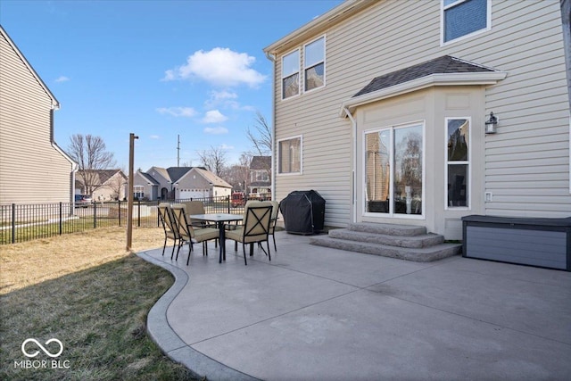 view of patio featuring grilling area, a fenced backyard, and entry steps