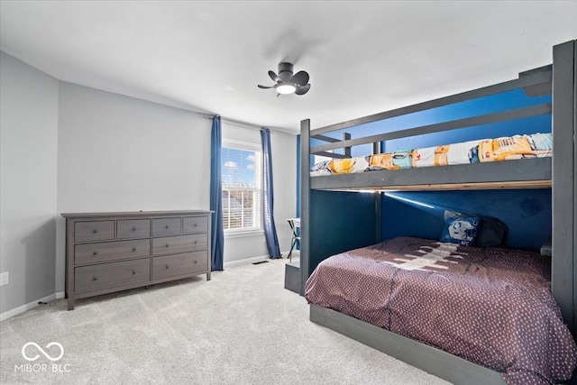 carpeted bedroom featuring baseboards