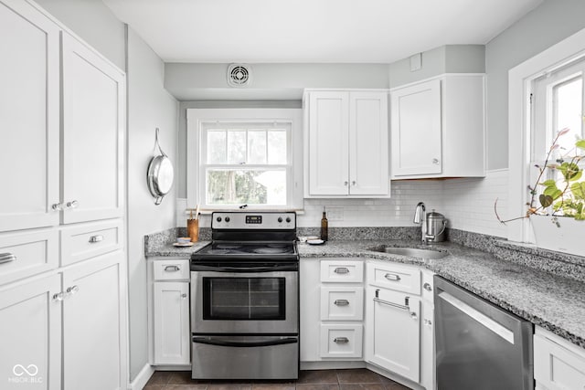 5426 Broadway St, Indianapolis, IN 46220 - kitchen with stainless steel appliances, visible vents, a sink, and a healthy amount of sunlight