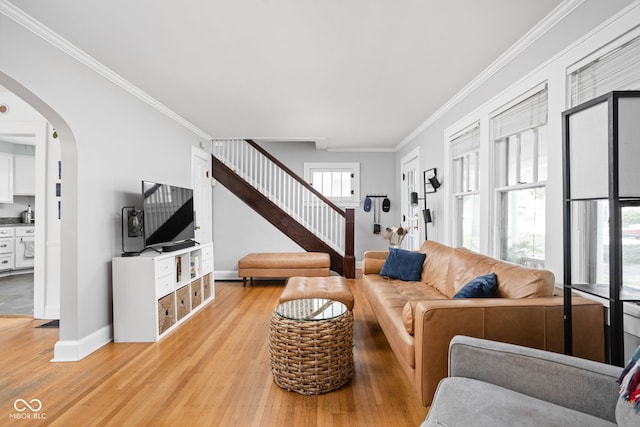5426 Broadway St, Indianapolis, IN 46220 - living area with light wood-style floors, arched walkways, ornamental molding, stairs, and baseboards