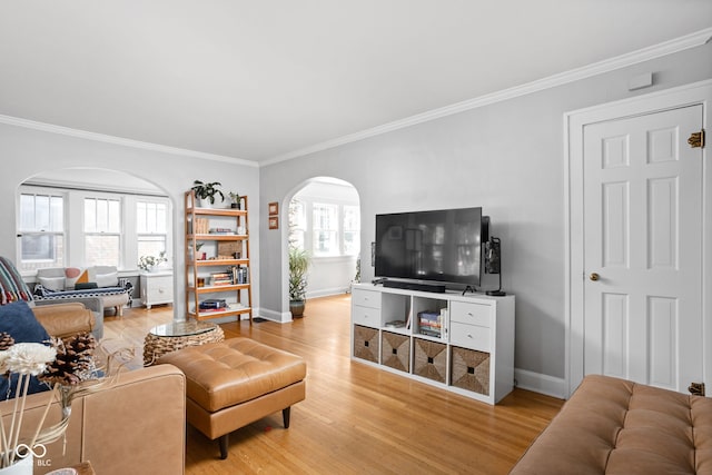 5426 Broadway St, Indianapolis, IN 46220 - living area featuring arched walkways, light wood finished floors, baseboards, and ornamental molding