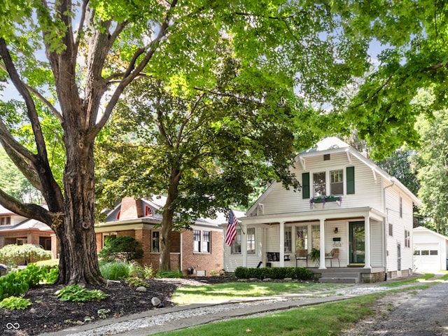 5426 Broadway St, Indianapolis, IN 46220 - view of front of property with a porch, an outbuilding, and a garage