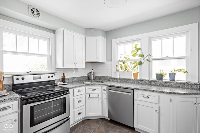 5426 Broadway St, Indianapolis, IN 46220 - kitchen with a sink, visible vents, a wealth of natural light, and appliances with stainless steel finishes