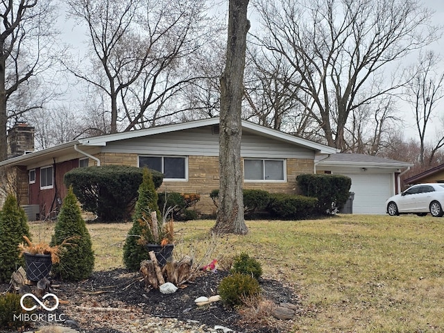 view of front of home featuring a chimney, stone siding, a front lawn, and a garage