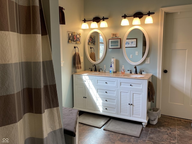 full bath with a sink and double vanity