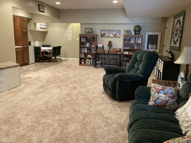 living room featuring recessed lighting, baseboards, and light colored carpet