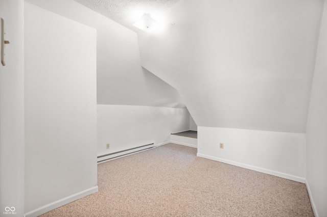 bonus room featuring baseboards, lofted ceiling, a textured ceiling, carpet flooring, and baseboard heating