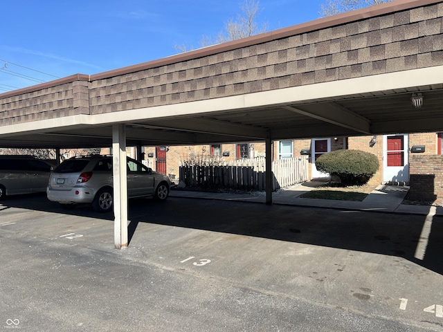 covered parking lot with fence