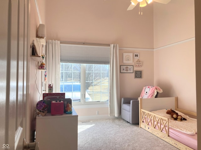 carpeted bedroom with baseboards