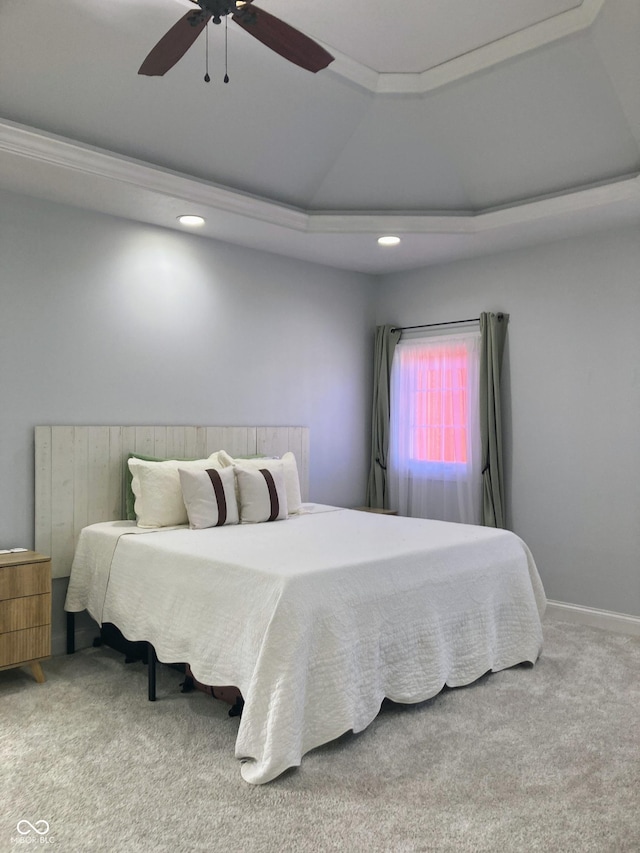 carpeted bedroom with baseboards, recessed lighting, a ceiling fan, and a tray ceiling