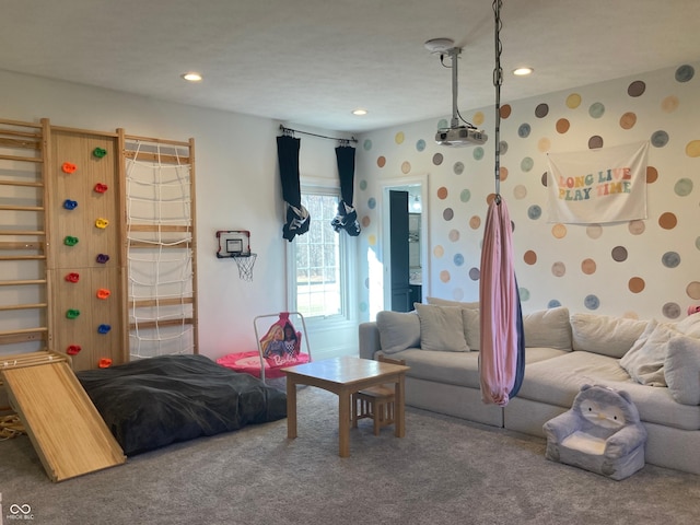 carpeted living area with recessed lighting and wallpapered walls