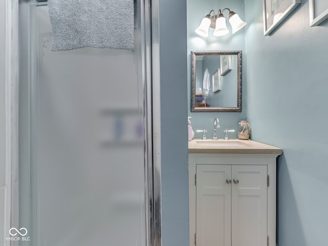 bathroom featuring a stall shower and vanity