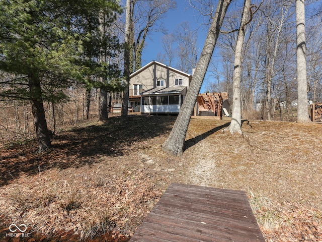 view of front of property featuring a sunroom