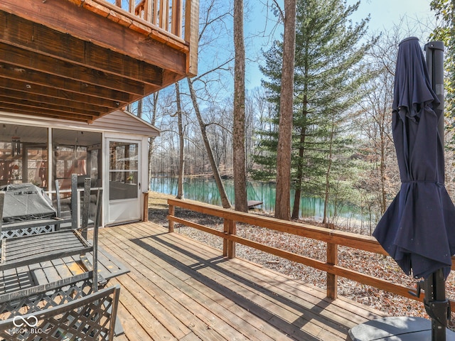 wooden terrace with a water view