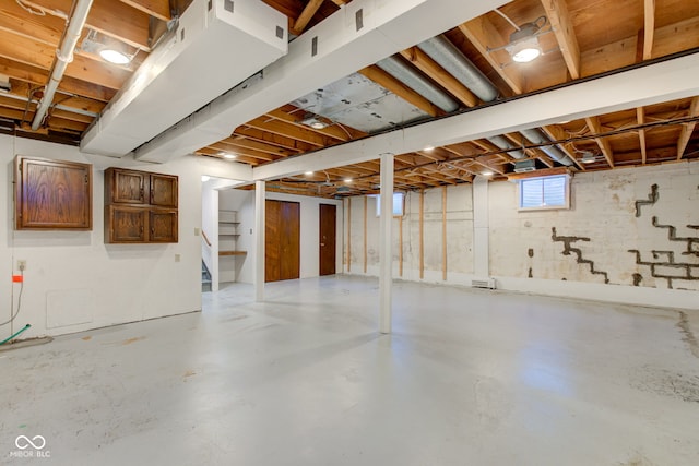 basement featuring stairs