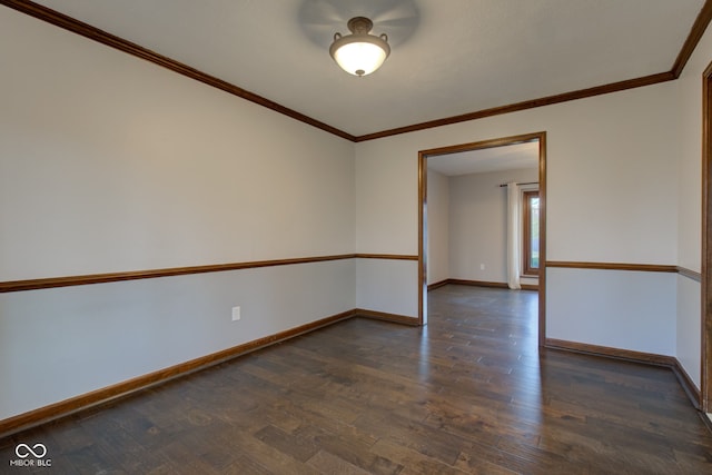 empty room featuring baseboards and dark wood finished floors