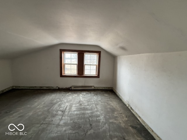 bonus room featuring vaulted ceiling and a baseboard radiator