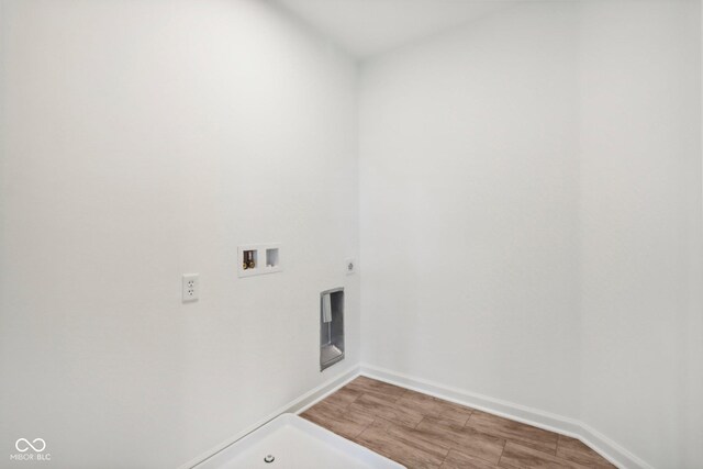 washroom featuring washer hookup, laundry area, and baseboards