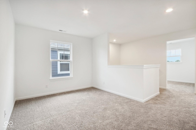 unfurnished room featuring recessed lighting, baseboards, and carpet floors