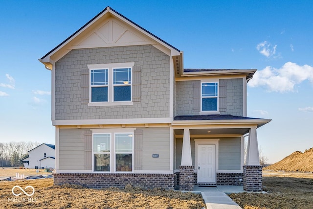 view of front of house featuring brick siding