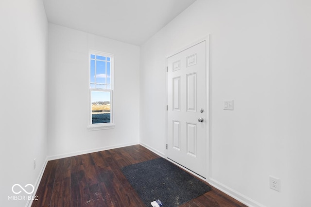 interior space with dark wood finished floors and baseboards