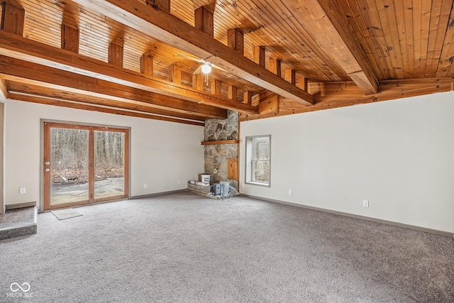 unfurnished living room with wood ceiling, baseboards, beam ceiling, and carpet floors