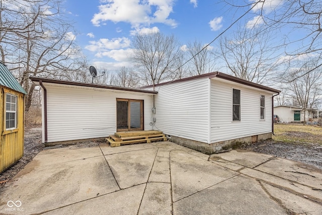 rear view of house featuring a patio