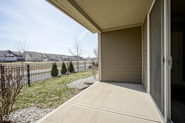 view of patio with a fenced backyard and a residential view