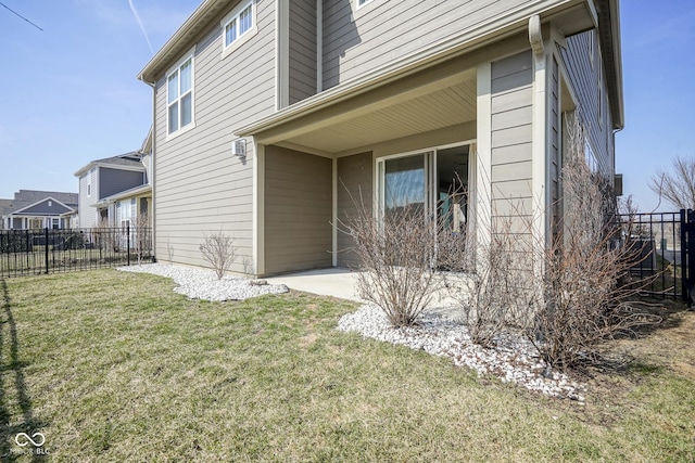 exterior space featuring a patio area, a yard, and fence