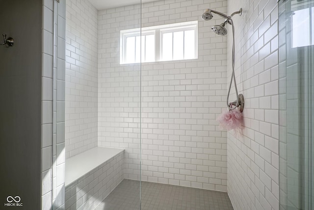 full bathroom featuring a wealth of natural light and a stall shower