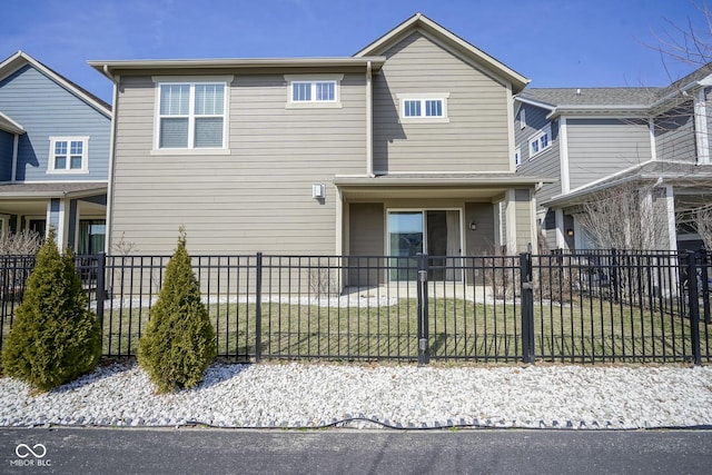 view of front of property with a front lawn and a fenced front yard