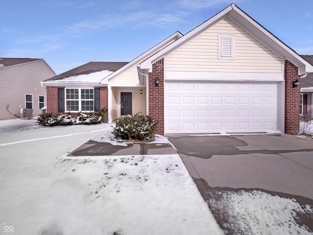 ranch-style house with an attached garage, brick siding, and driveway