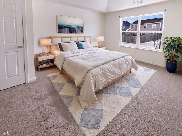 bedroom featuring carpet flooring, visible vents, and baseboards