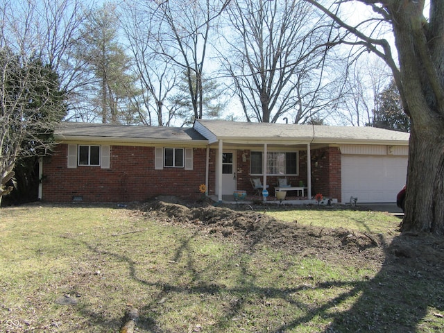 single story home featuring crawl space, a garage, a front lawn, and brick siding