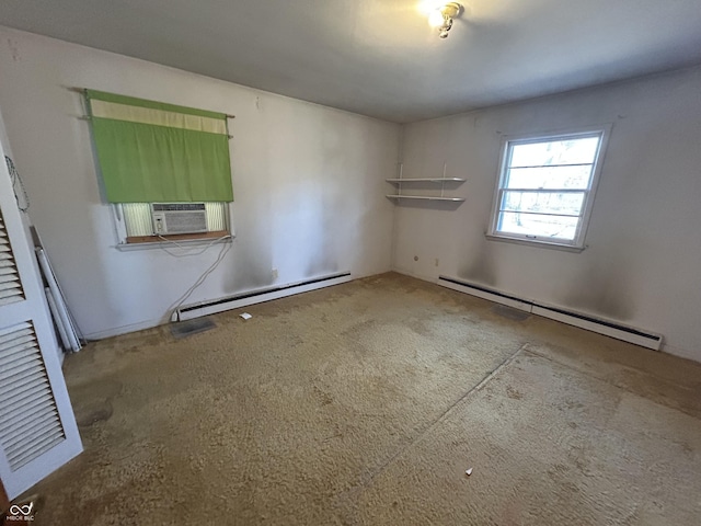 empty room with a baseboard heating unit and cooling unit