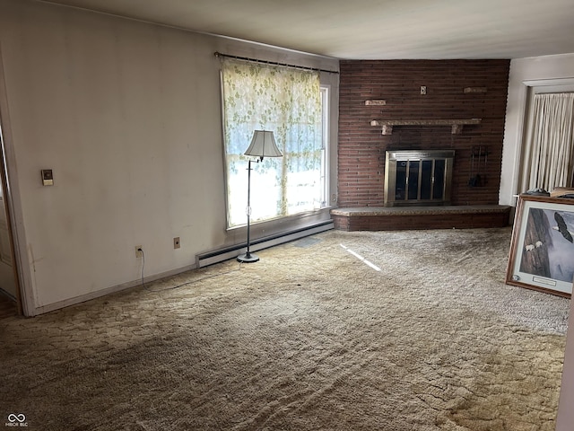 unfurnished living room with baseboard heating, carpet flooring, a brick fireplace, and baseboards