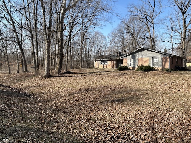 exterior space featuring a chimney