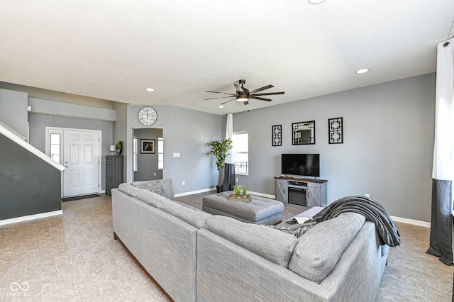 living area featuring recessed lighting, baseboards, and ceiling fan