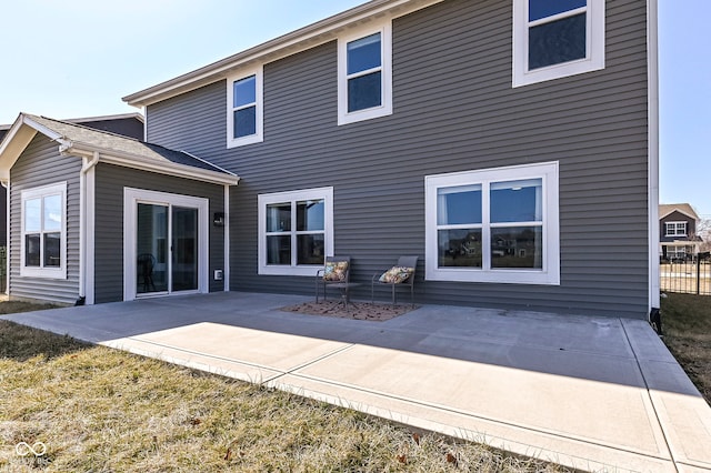 back of property featuring a patio area