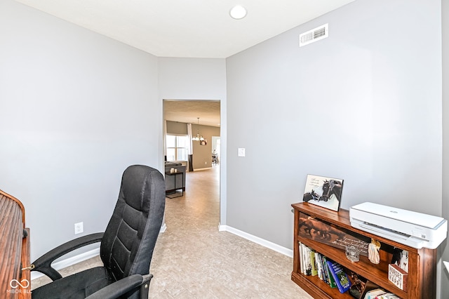 home office featuring a notable chandelier, visible vents, and baseboards