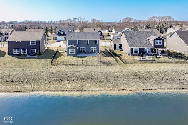 birds eye view of property with a residential view