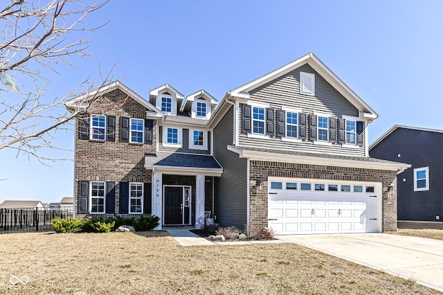 view of front of home featuring fence, brick siding, and driveway