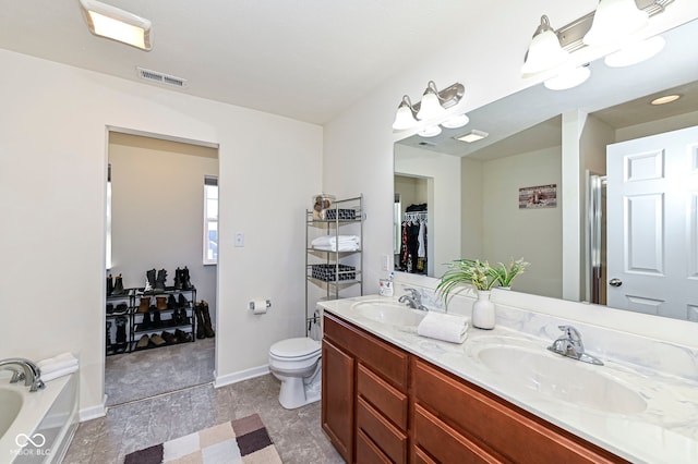 full bath featuring double vanity, visible vents, a garden tub, and a sink