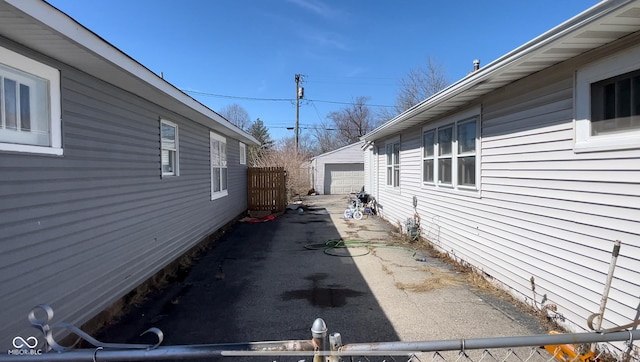 view of home's exterior with an outbuilding and a detached garage