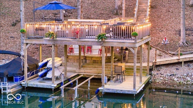 view of dock featuring a deck and stairs