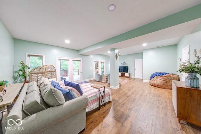 8205 Bass Dr, Nineveh, IN 46164 - living room featuring wood finished floors, healthy amount of natural light, baseboards, and recessed lighting