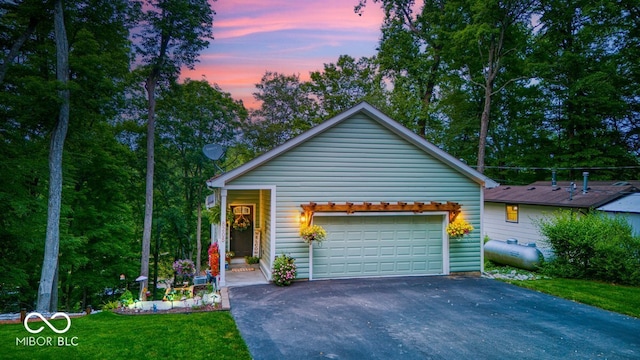 8205 Bass Dr, Nineveh, IN 46164 - view of front of property featuring a garage, driveway, and a front lawn